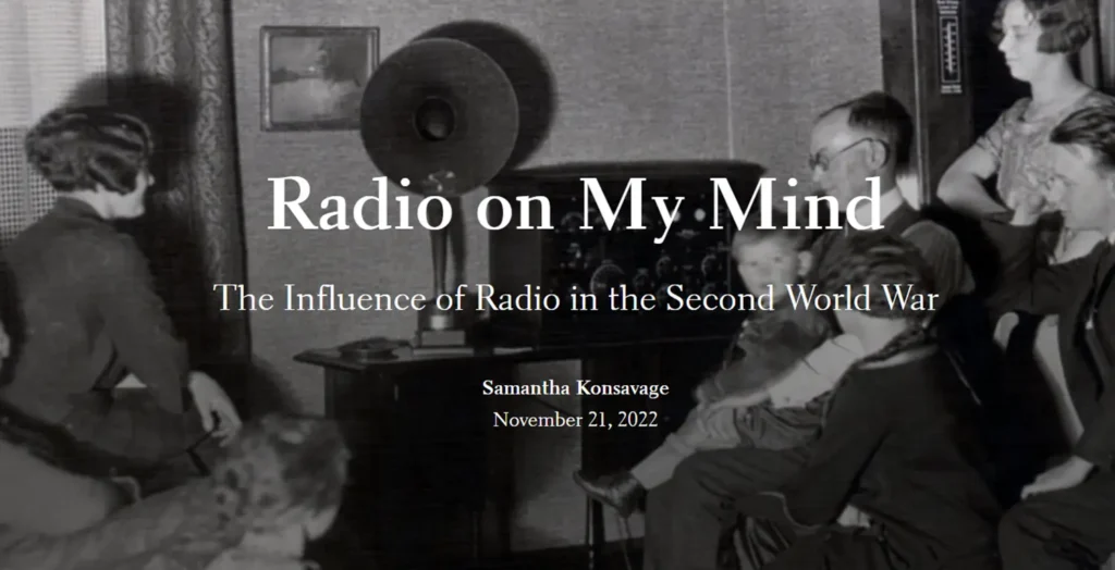 Family huddled aroun an old-fashioned Radio